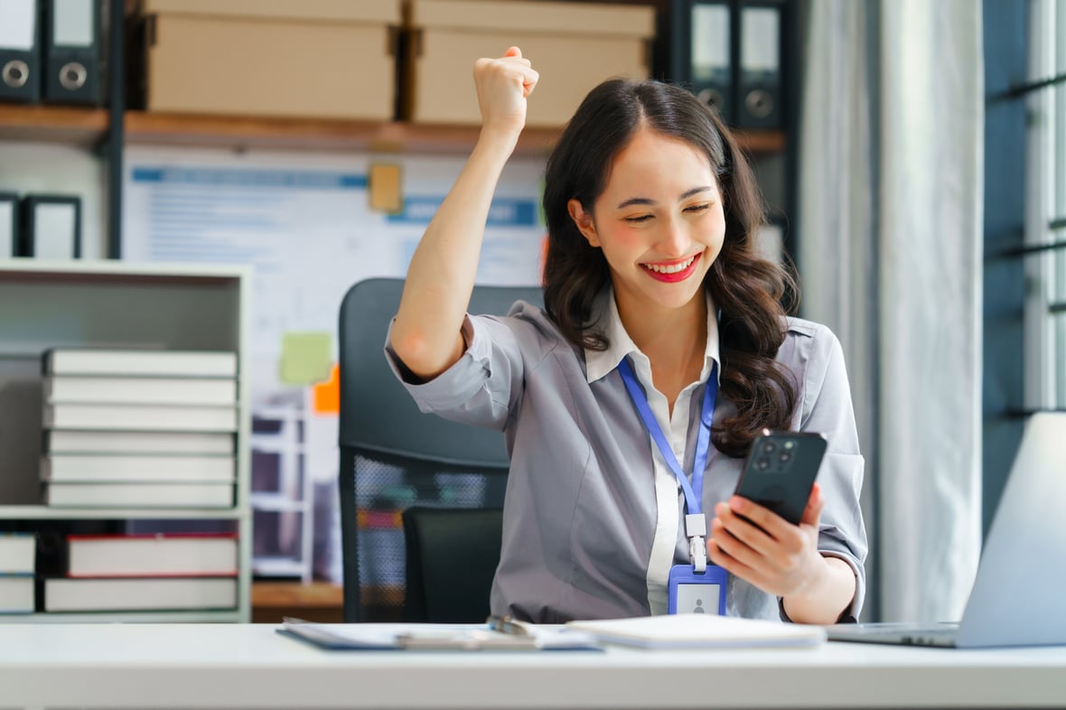 an accounting expert celebrating a victory in her office