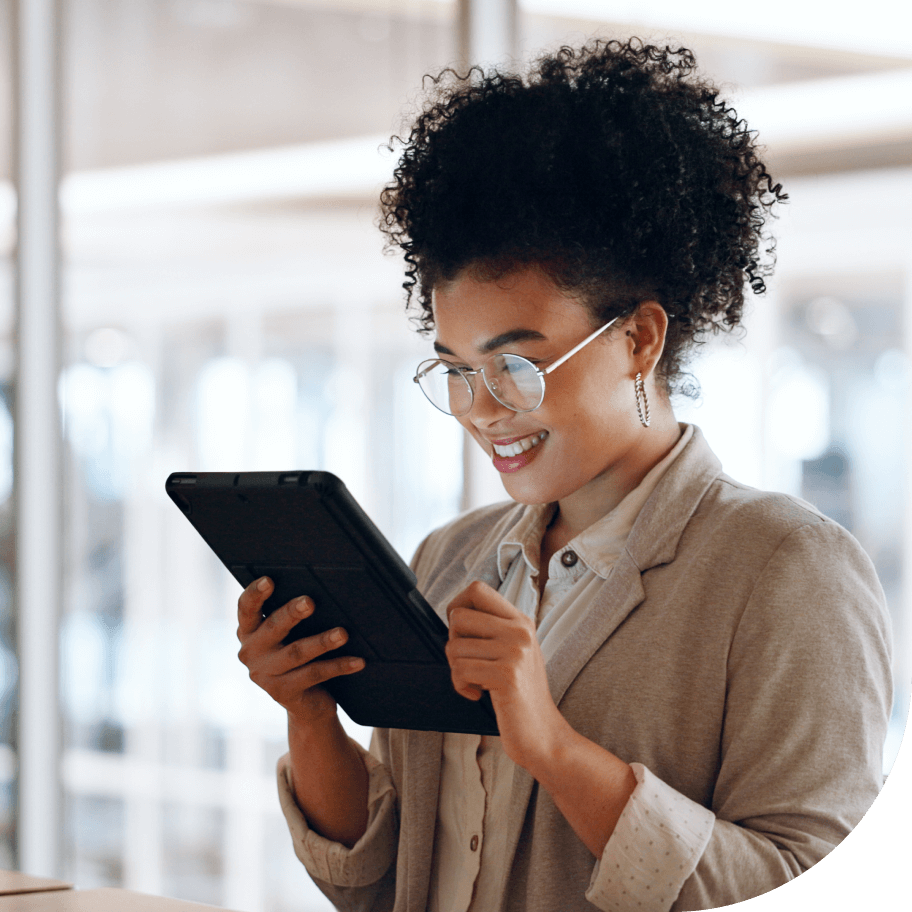 Female professional smiling while talking using tablet