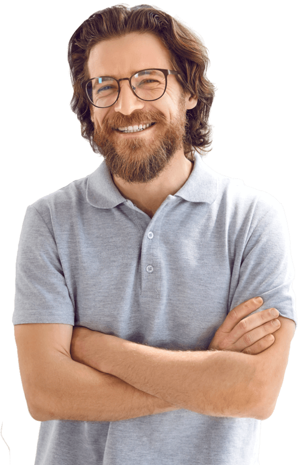 A man wearing glasses and a polo smiling at the camera